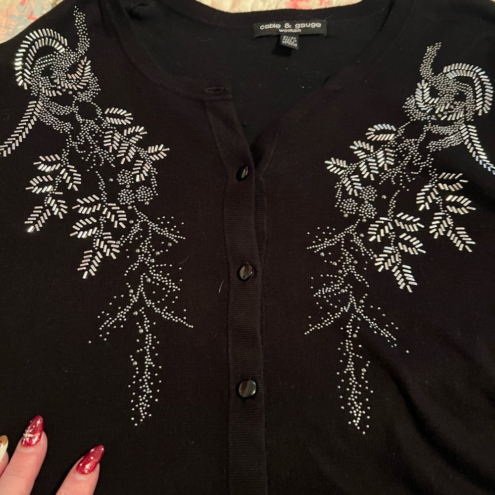 Woman’s black sweater Stunning!
